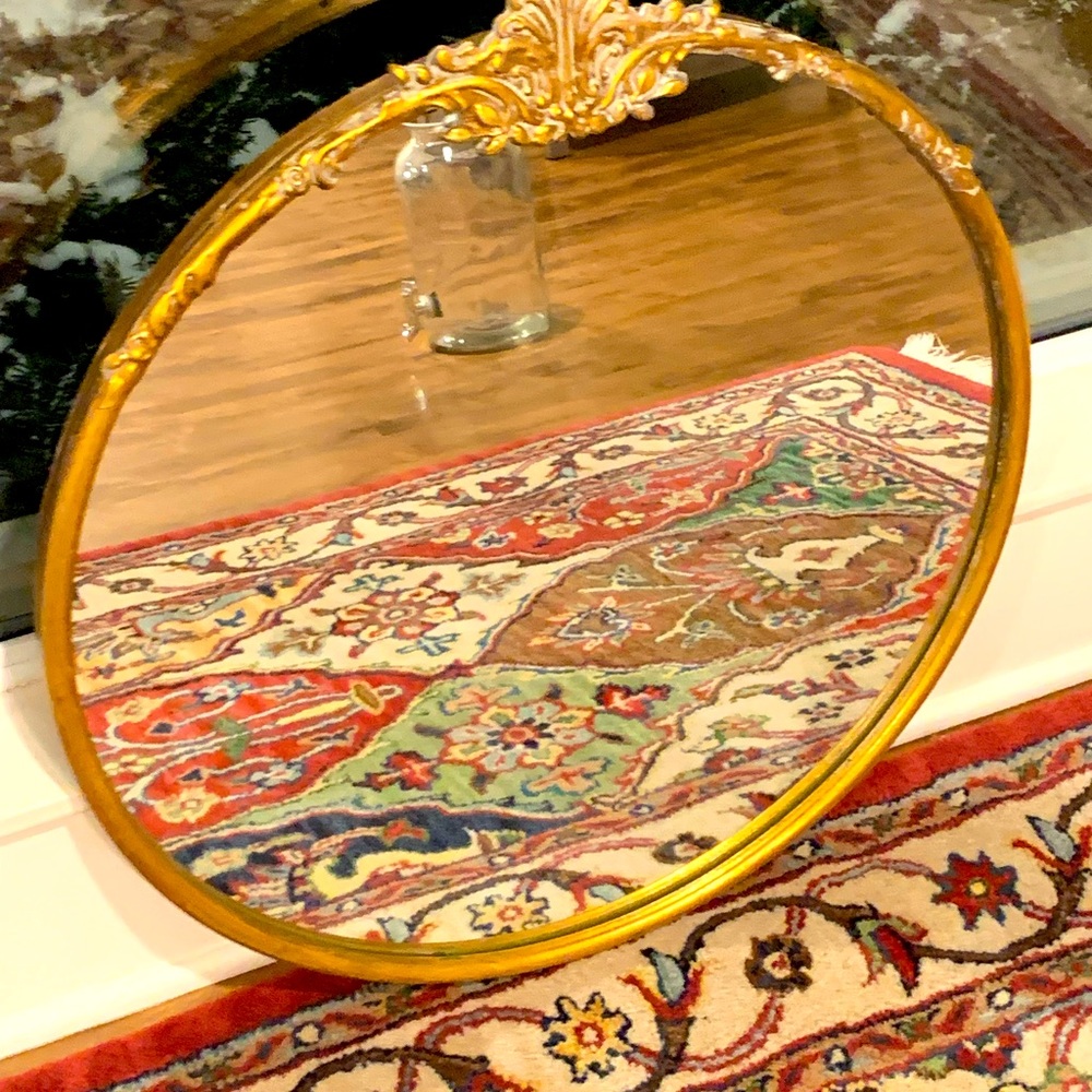 The mirror with the golden frame